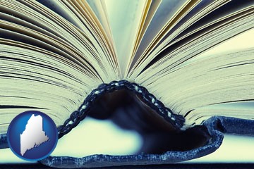 a hardcover book spine (macro photo) - with Maine icon